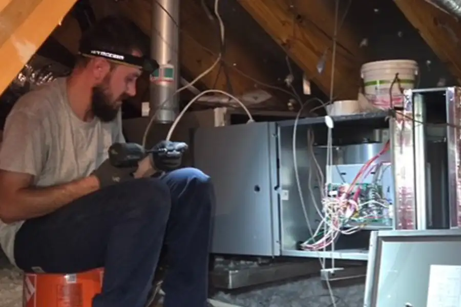 HVAC technician installing a furnace for Harris Air