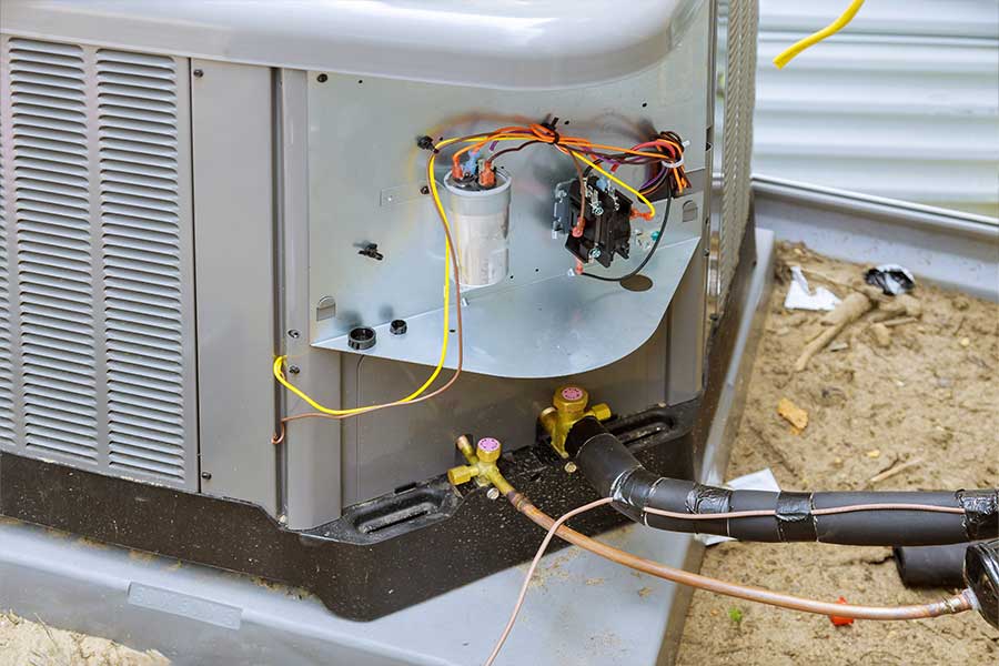 Open air handler with exposed wiring during an HVAC inspection in McKinney, TX