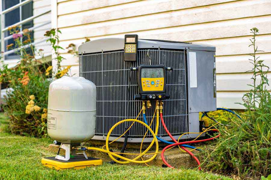 Technician performing an HVAC inspection on an outdoor AC unit in McKinney, TX