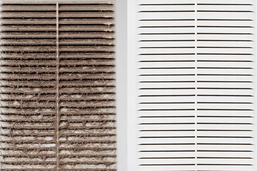 Comparison of a dirty and clean air vent after HVAC ductwork installation